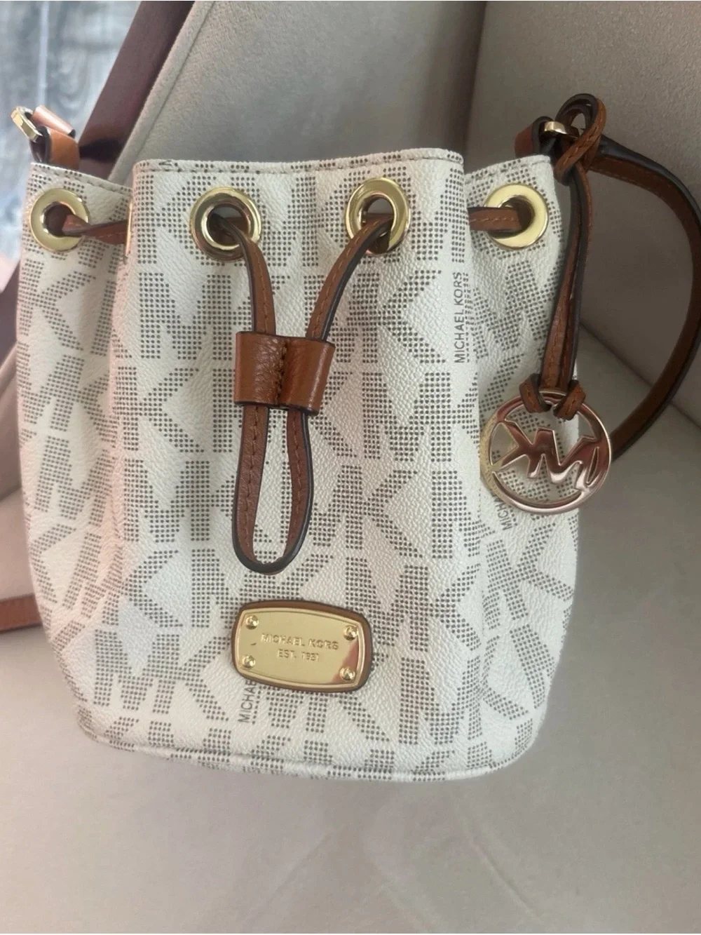 Michael Kors Cream Logo Drawstring Crossbody with Brown Trim and Gold Hardware